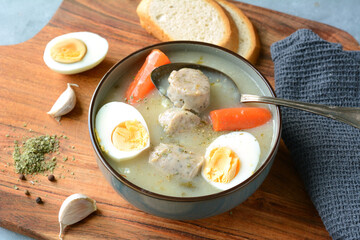 The sour soup (zurek) made of rye flour with sausage and egg. Popular Easter dish
