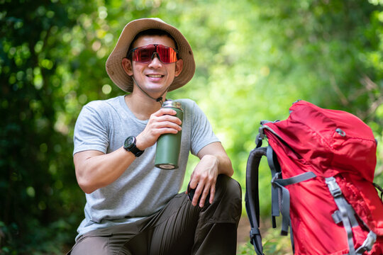 happy asian study relax during backpack travel in trail hike trekking journey extreme sport activity trip in nature forest environment mountain in summer