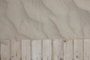 wooden boards on beach sand