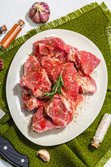Raw pork loin pieces with ground spices. Fresh meat cut, ingredient for cooking protein food