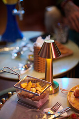 Hot fries on table in bar, pub or restaurant