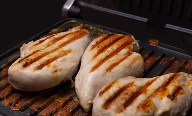 chicken breast cooked on an electric grill. Beautiful grilled chicken