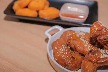 Fried chicken  and nuggets served on the table