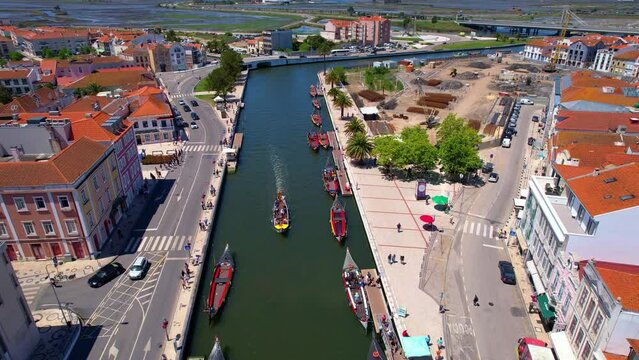 aerial view of typical Portugal houses near the canal with moliceiro boats at the old town embankment in Aveiro city center