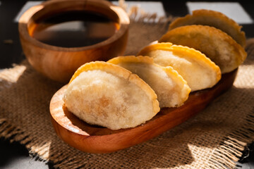 Cireng with chicken filling in a wooden bowl. Cireng is a traditional West Javanese food made from tapioca flour
