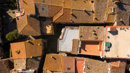 Aerial perpendicular view of Sutri, a small town near Viterbo and Rome, Italy. All houses have traditional red tiled roofs.