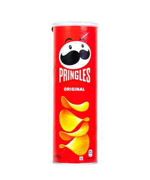 WARSAW - MARCH 05: Red long tube with Pringles logotype, original taste isolated on white in Warsaw on March 05. 2023 in Poland. Pringles is an American brand of stackable potato-based chips.