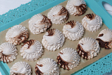 Marshmallow flowers on trays. Homemade zephyr. Close-up.