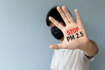 men wearing a mask to protect air pollution and PM2.5 dust with showing palm hand. stop PM 2.5....