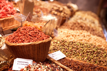 nuts and dried fruits on the counter in the market