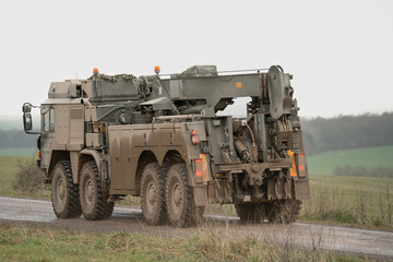 Fototapeta premium British army MAN SVR (Support Vehicle Recovery) 8x8 in motion on a dirt track