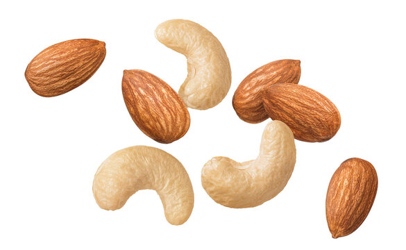 Flying fresh cashew and almond nuts isolated on white background. Top view