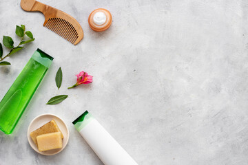 Set of hair care and styling products with flowers