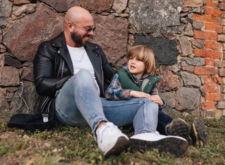 Portrait of father and son outdoors