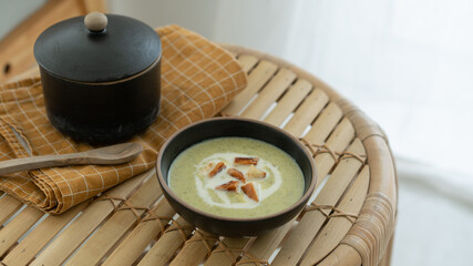 Broccoli Soup on a wooden Table