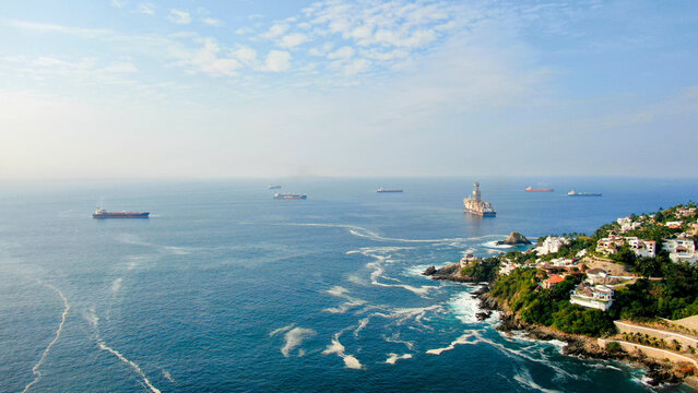Aerial view of Peninsula de Santiago in city Manzanillo, Mexico.  Offshore   drilling ship platform and tanker ships  at anchor in the bay