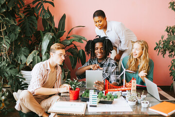 diversity and international group of young people students working on eco friendly urban city project with renewable energy, sustainable development using alternative energy sources, botanical studio