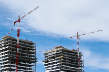 Cranes for the construction of building towers.