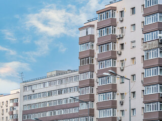 Fototapeta premium New reconditioned old communist apartment building. Ugly traditional communist housing ensemble