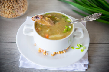 dried pea soup in a plate with herbs