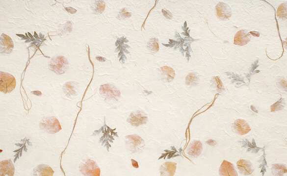 Rustic Handcrafted Paper with Embedded Green and Gold Leaves