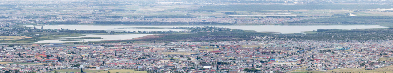 aerial cityscape with Zeekoevlei lakes and southern neighborhoods, from Silver Mine, Cape Town