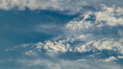 Fluffy white clouds and blue sky. A white fluffy cloud.