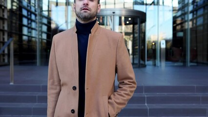 Stylish corporate young professional businessman walking out of office building. Business people concept