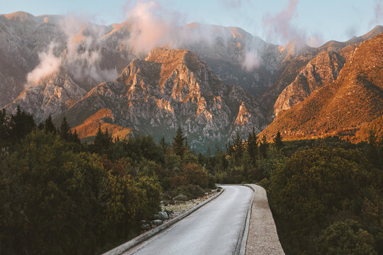 Empty road way to the sunset mountains landscape in Albania Travel summer vacations trip scenic nature view Balkans beautiful destinations