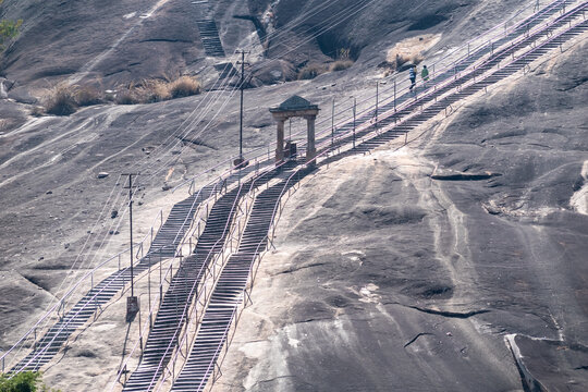 Steps leading up the exposed rock face of the ancient Vindhyagiri hill to the Jain pilgrimage site and temple of Gommateshwara Bahubali.