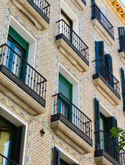 Naklejka premium Vintage luxury living in city's artistic and colourful classic district of Fuencarral, downtown Madrid, Spain. Vertical photo
