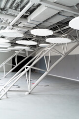 Ventilation System Under Ceiling of Modern Warehouse or Shopping Center. Metal Piping for Air Conditioning