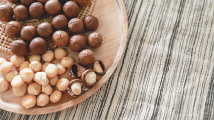 Organic Macadamia nut. macadamia nuts are cracked and baked to taste extremely delicious superfood fresh natural shelled unsalted raw macadamia and healthy food concept