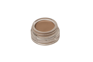 A brow pomade in blonde shade with brush isolated on a white background.