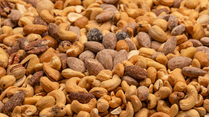 A group of almonds, pistachios, walnuts, macadamia, cashews.
