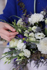 a beautiful spring bouquet in white and blue tones