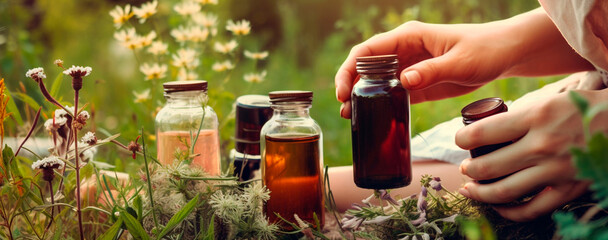 woman hands in the garden with medicinal herbs and herbal tinctures in bottles. Generative AI, - obrazy, fototapety, plakaty