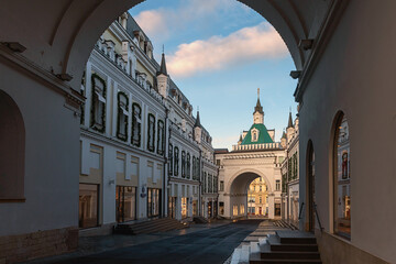 view from under the arch to a shopping street with branded stores in the center of Moscow, Russia - 585909389