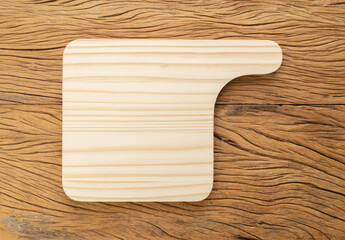 Empty wooden board over wooden table with copy space