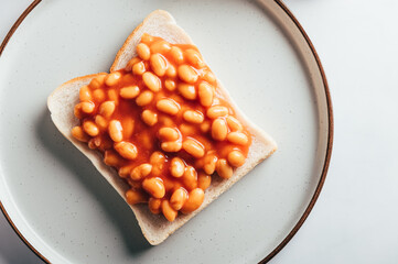 Baked Beans in Tomato Sauce on Slice of Toasted Bread, traditional British breakfast