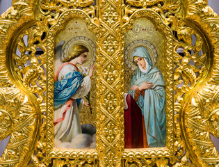Hand-painted icon of the Annunciation in the golden iconostasis of the Orthodox Church