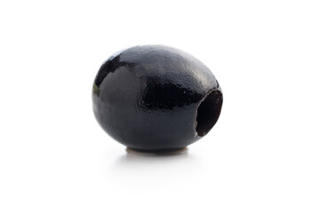 Pitted black olive isolated on white background.