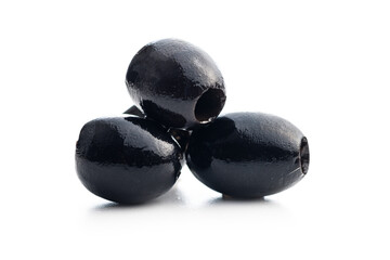 Pitted black olives isolated on white background.