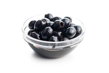 Pitted black olives in bowl isolated on white background.