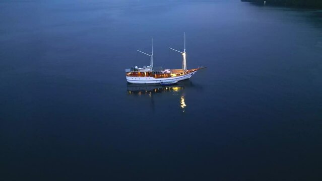 Aerial Footage. Early morning  view of Luxury sailboat in calm ocean