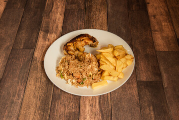 This succulent stew is accompanied by a prey (chicken or duck) that must have been cooked together with the rice