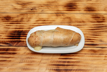 simply little piece is a typical roll of the gastronomy of Venezuela. It is part of the breakfast of Venezuelans. The bread is usually accompanied by coffee with milk, malt drink, orangeade