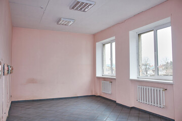 The room needs renovation. Worn out walls and communications.