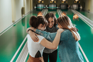 Female Friends Celebrating In A Bowling Alley
