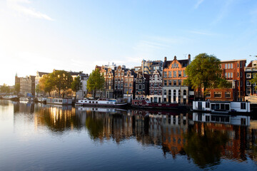 Fototapeta na wymiar Amsterdam Netherlands dancing houses over river